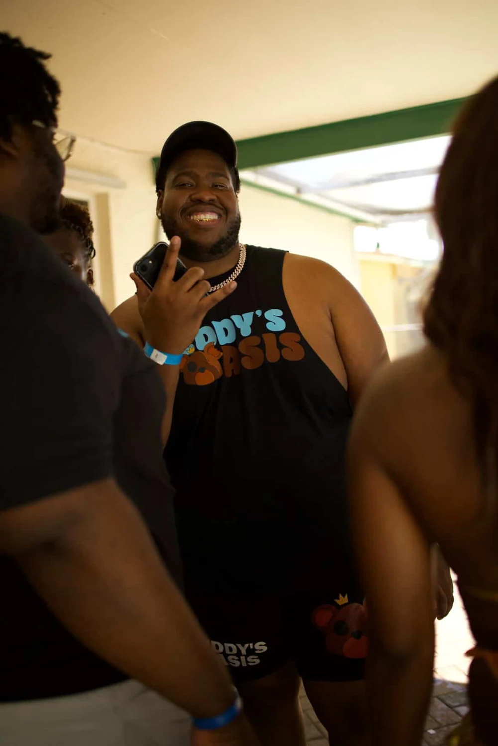 Johnson Teddy Sinophat, founder of MotionWork Promotions, smiling at a Teddy’s Oasis gathering